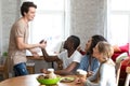 Smiling Caucasian man shaking hand of African American friend Royalty Free Stock Photo