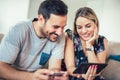 Smiling happy couple couple with tablet pc computer and credit card at home Royalty Free Stock Photo