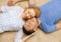 Smiling happy couple lying on floor at home Royalty Free Stock Photo