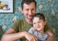 Smiling happy dad and son playing near in the house. Happy family. Royalty Free Stock Photo