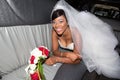 Happy dark skin black amercian bride in luxury limousine car for wedding