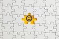 Smiling happy face icon on missing puzzle piece. Customer or client satisfaction