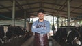 Smiling and happy farmers at the dairy farm. Agriculture industry, farming and animal husbandry concept ,Cow on dairy farm eating Royalty Free Stock Photo