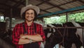 Smiling and happy farmers at the dairy farm. Agriculture industry, farming and animal husbandry concept ,Cow on dairy farm eating Royalty Free Stock Photo