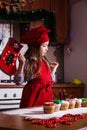 Festive red apron Christmas party dinner dessert peppermint cupcakes cheese cream sugar sprinkling decoration girl new