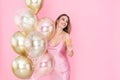 Smiling happy girl holds glass of champagne and many air balloons. came to party. Celebration Royalty Free Stock Photo