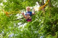 Girl bungee jumping in trampoline Royalty Free Stock Photo