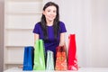 Smiling happy girl prepares bags gifts for Christmas Royalty Free Stock Photo