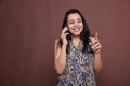 Smiling happy indian woman talking on smartphone, laughing Royalty Free Stock Photo