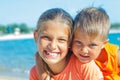 Smiling happy kids on the beach Royalty Free Stock Photo