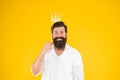Smiling Happy King. Brutal Bearded Man King. Costume Party. Happy Birthday. Hipster Booth Props Yellow Background. Ready