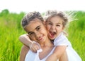 Smiling happy little girls on meadow Royalty Free Stock Photo
