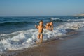 Smiling and happy mother and her son playing the beach. Concept of friendly family. Mexico beach. Royalty Free Stock Photo