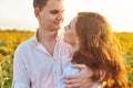 Smiling happy newlywed couple in a field of sunflowers. The concept of love, mutual respect and right relationships. Close up Royalty Free Stock Photo