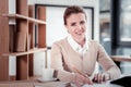 Smiling happy office worker feeling relaxed having coffee break Royalty Free Stock Photo