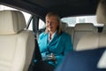 Smiling Happy Old Senior Business Woman 60-65 Years Using Laptop in Car Royalty Free Stock Photo