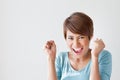 Smiling, happy, positive, excited woman on plain background