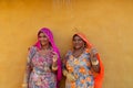 Smiling and happy Rajasthani women in local costume, posing in a Rajasthani village