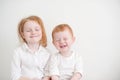 Smiling happy red-haired brother and sister