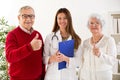 Smiling and happy senior couple with doctor, close up Royalty Free Stock Photo