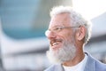 Smiling happy senior old business man wearing suit outdoor headshot portrait. Royalty Free Stock Photo