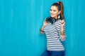 Smiling happy teenager girl portrait on blue wall background. Royalty Free Stock Photo