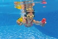 Smiling happy underwater kid in swimming pool