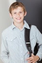 Smiling happy vivacious young schoolboy Royalty Free Stock Photo