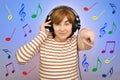 Happy woman with headphones and colorful musical notes