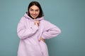 Smiling happy young beautiful brunette female person with sincere emotions isolated on background wall with copy space Royalty Free Stock Photo