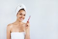 Smiling happy young woman with healthy teeth holding a tooth brush. Clean beauty and healthy concept Royalty Free Stock Photo