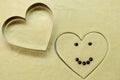 Smiling heart with chocolate eyes and smile with cooking shape heart top view. Romantic concept. Valentines day symbol. Royalty Free Stock Photo