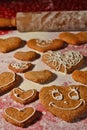 Lots of gingerbread in the shape of a heart on a bed of flour