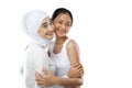 Smiling hijab girl and asian young girl bestfriend in front of camera with copy space