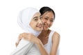 Smiling hijab girl and young girl bestfriend in front of camera