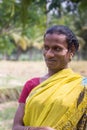 Smiling Hijra transgender person in rural setting.