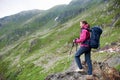 Woman trekking in romanian green rocky mountains. Royalty Free Stock Photo