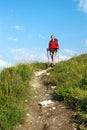 Smiling hiking young woman with backpack