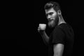 Smiling hipster bearded man holding coffee cup