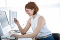 smiling hipster business woman inputting her credit card details Royalty Free Stock Photo