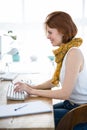 smiling hipster businesswoman typing on her computer Royalty Free Stock Photo