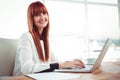 Smiling hipster businesswoman using her laptop Royalty Free Stock Photo