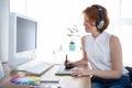 smiling hipster businesswoman writing on a digital drawing tablet Royalty Free Stock Photo