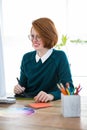 smiling hipster designer writing on a digital tablet Royalty Free Stock Photo