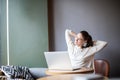 Smiling hipster girl freelancer take break between work on portable notebook