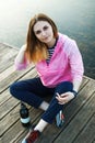 Smiling hipster girl on pier Royalty Free Stock Photo