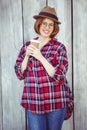 smiling hipster woman holding a coffee cup Royalty Free Stock Photo