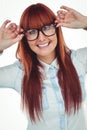 Smiling hipster woman holding her glasses Royalty Free Stock Photo