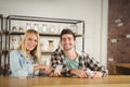 Smiling hipsters having coffee together Royalty Free Stock Photo