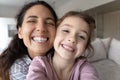 Smiling Hispanic mom and daughter make selfie together Royalty Free Stock Photo